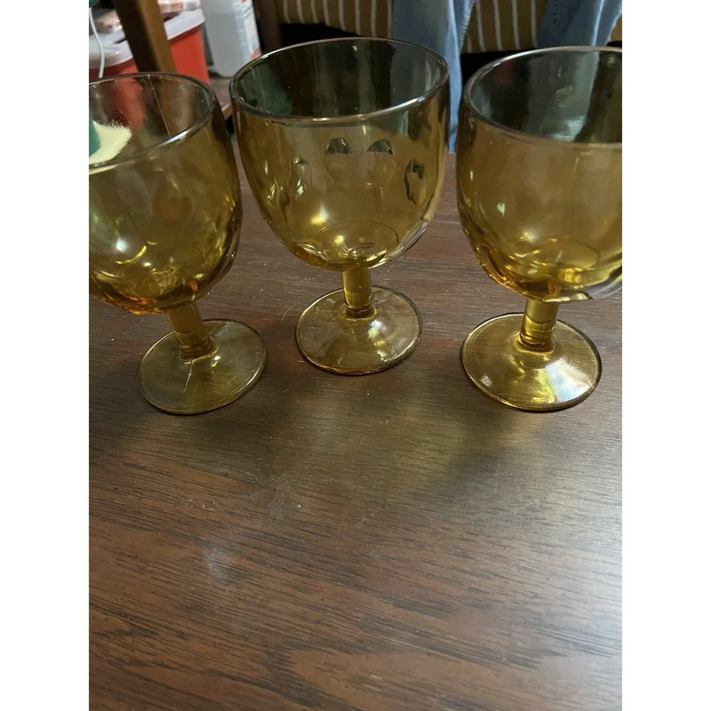 Set Of Three Amber Goblets: One Is A Thumbprint And Two Are Veined